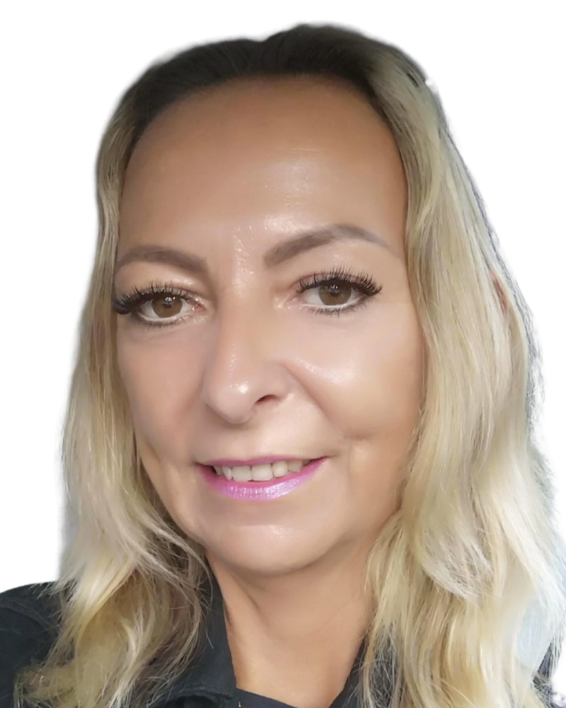 Close-up portrait of a smiling woman with shoulder-length blonde hair and light makeup against a white background.